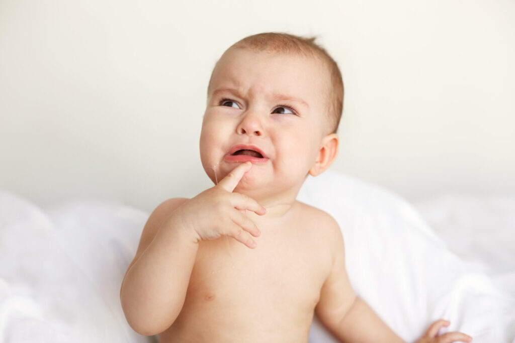 cute-nice-little-baby-woman-crying-lying-with-her-mom-bed-home-1024x683.jpg