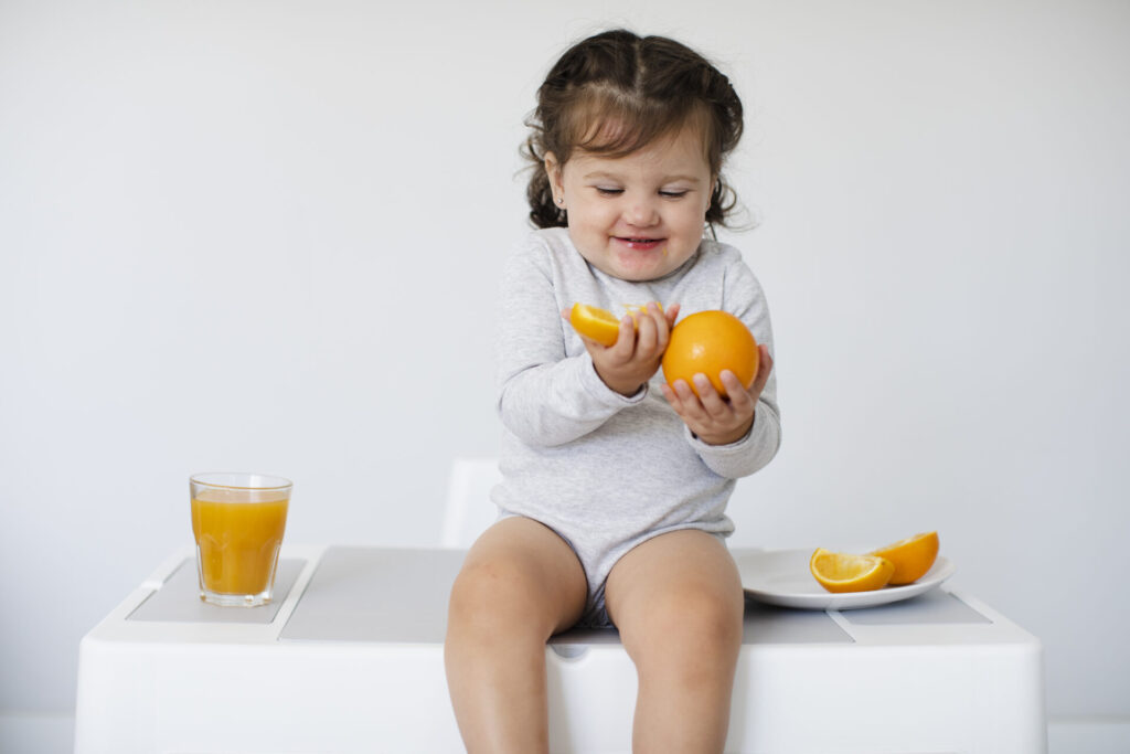 happy-girl-looking-her-oranges-1024x683.jpg